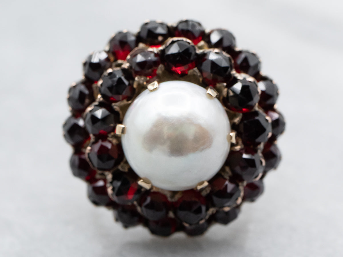 Vintage Mabe Pearl and Garnet Halo Cocktail Ring