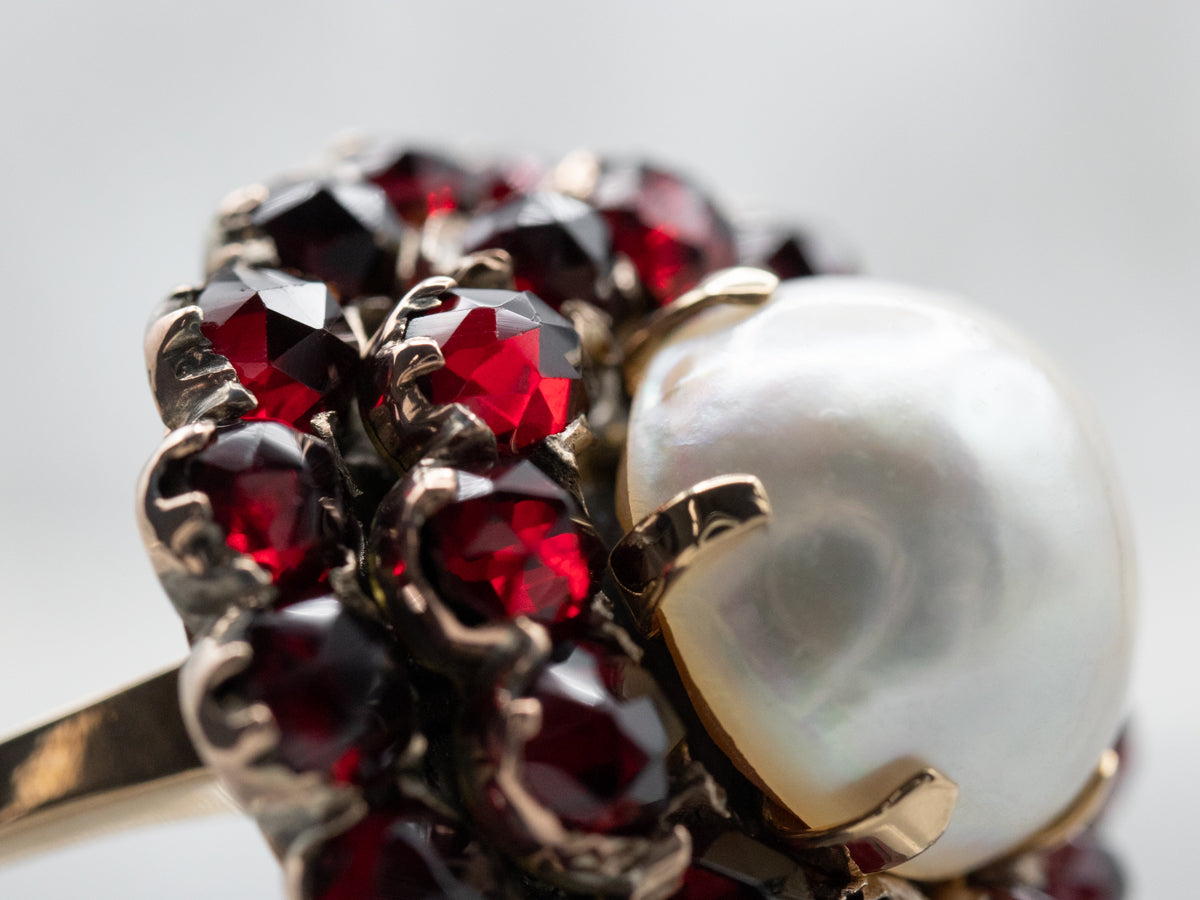 Vintage Mabe Pearl and Garnet Halo Cocktail Ring