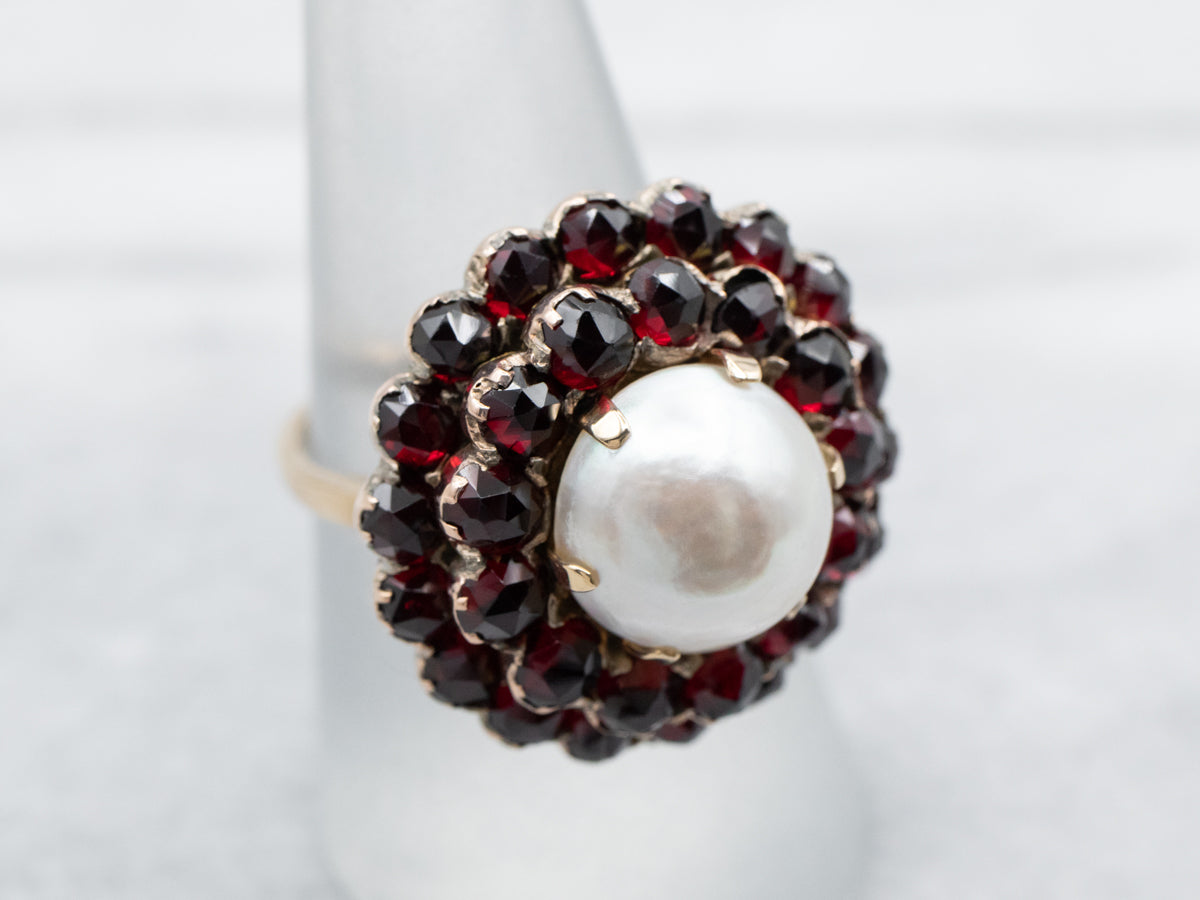 Vintage Mabe Pearl and Garnet Halo Cocktail Ring