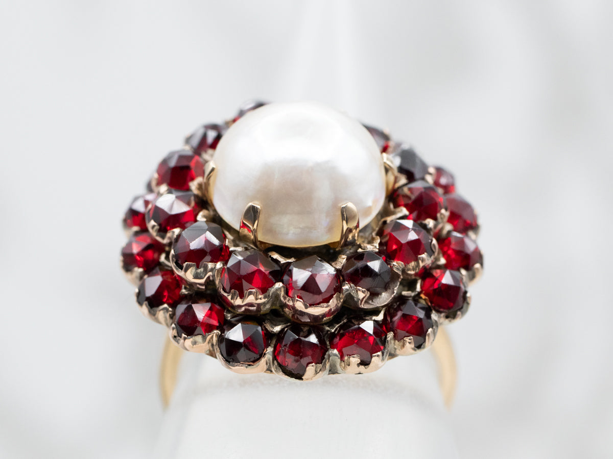 Vintage Mabe Pearl and Garnet Halo Cocktail Ring