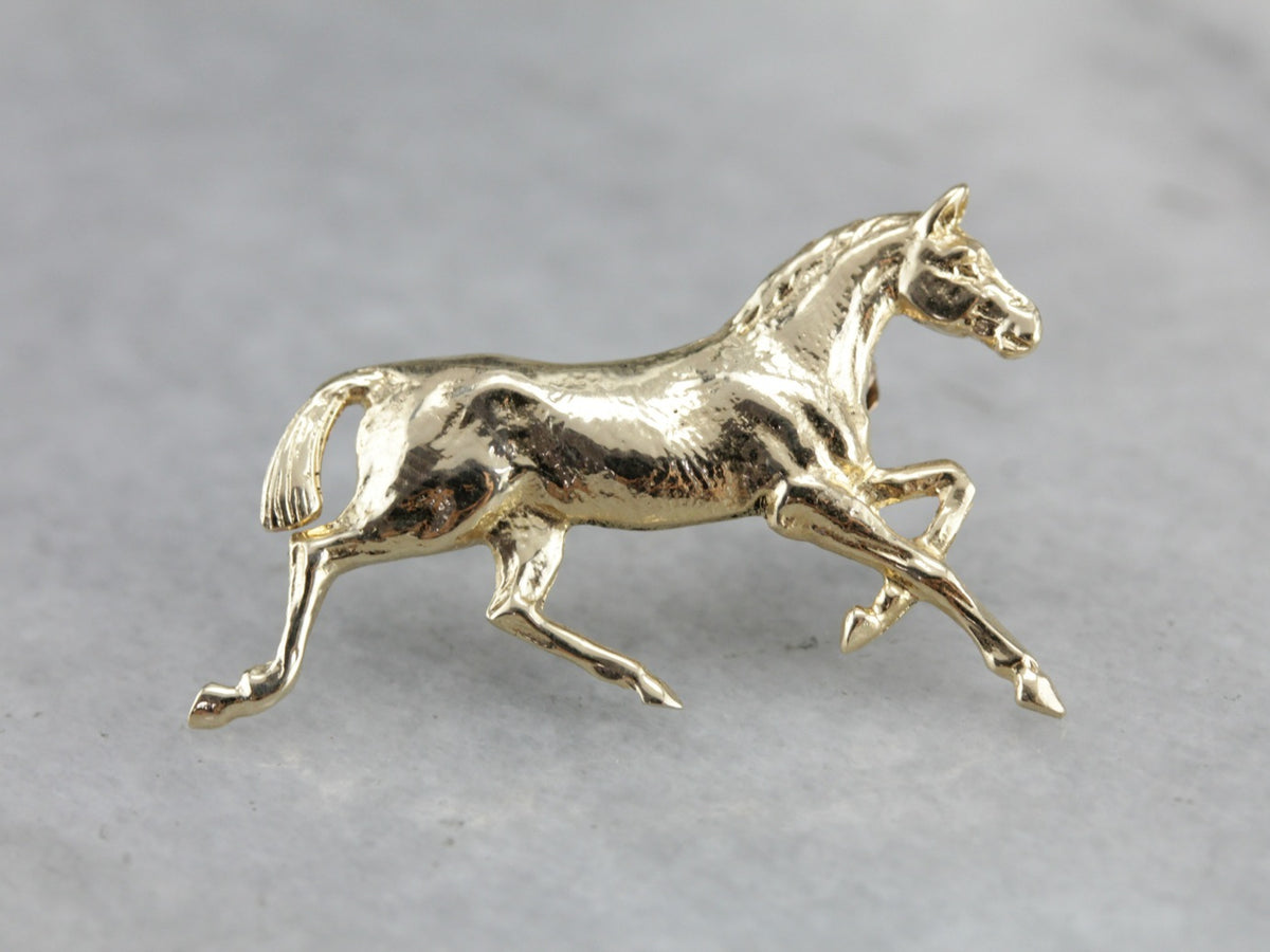 Golden Hooves: Galloping Horse Pin Crafted of Yellow Gold