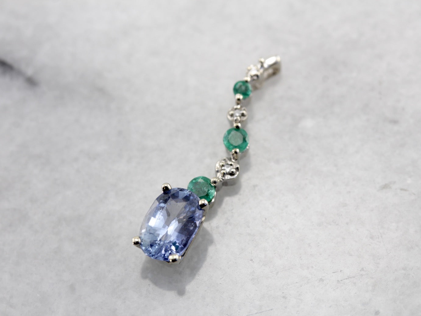 Unusual Pale Blue Sapphire, Emerald and Diamond Accented Pendant