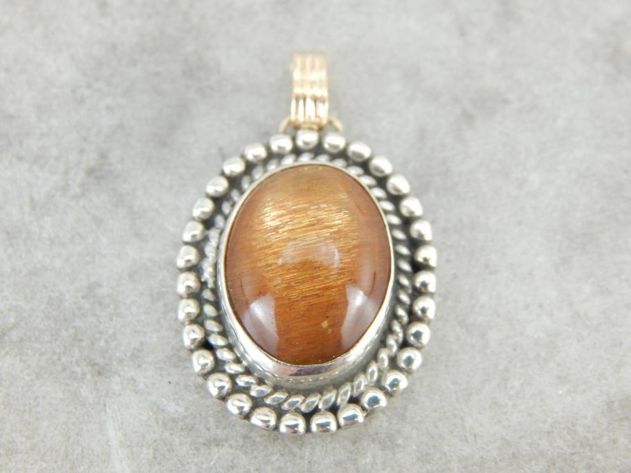 Glittering Orange Sunstone Pendant in Sterling and Gold Frame