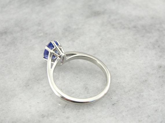 Twisting, Sleek Solitaire and Bright Tanzanite Ring