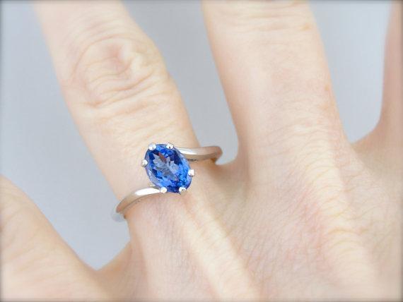 Twisting, Sleek Solitaire and Bright Tanzanite Ring