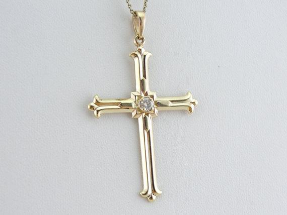 Nostalgia cross pendant. Foam gold. Kette was there and will be given as a free encore. Cross 5.5 x 3 cm. Centrum 2024 with blue strin.