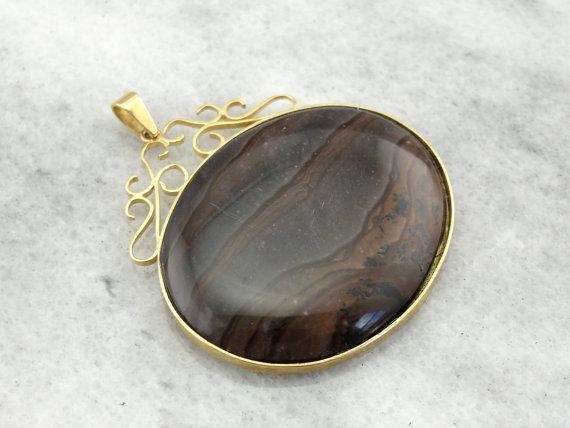 Stone: American Picture Jasper, 39 x31mm Oval
Accents: None
...